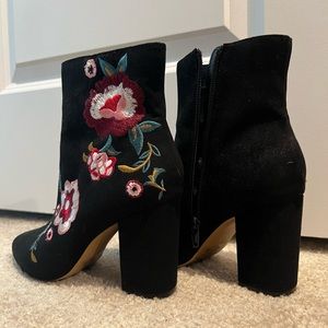 Express black booties with embroider detailing